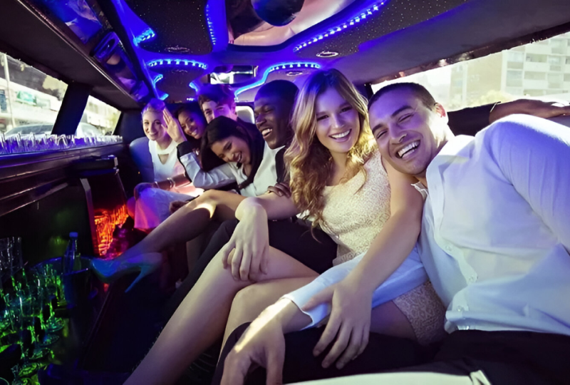 Group enjoying a limo party ride together.